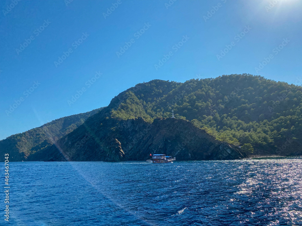Big beautiful tropical paradise island with mountains, plants and trees green and blue salty warm sea