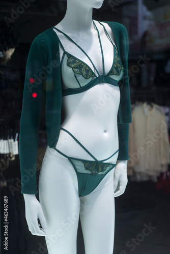 Closeup of green underwear on mannequin in a fashion store showroom