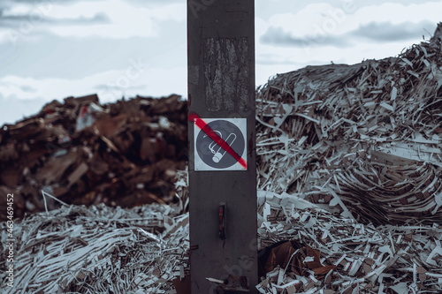 Photo of rubbish and garbage in the dump with the sign of no smoking photo