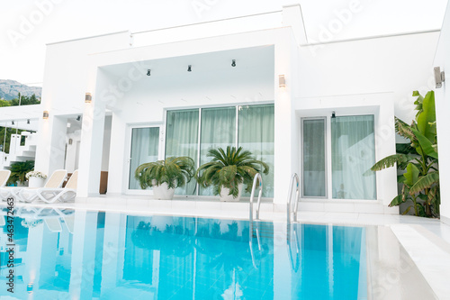 private white villa with a swimming pool