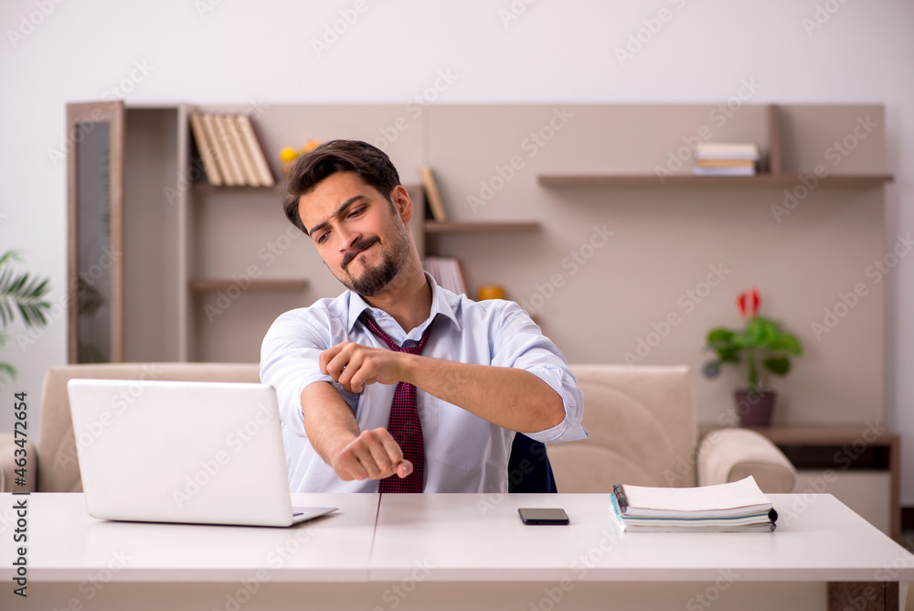 Young businessman working from house