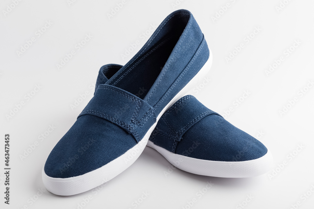 New stylish shoes, sneakers. Blue comfortable shoes on a white background. Women's shoes New stylish shoes, sneakers. Blue comfortable shoes on a white background. Women's shoes