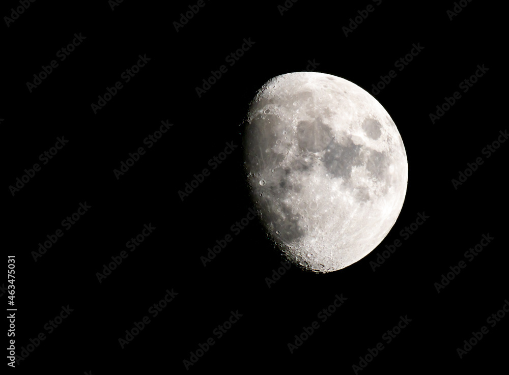 Naklejka premium Three Quarter Full Moon Against Black Sky - 40+ MP Image