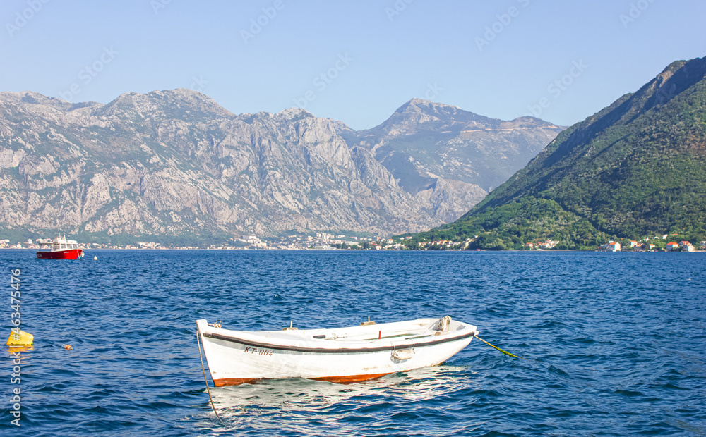 A boat in the middle of a lake in the Bay of Kotor. Perast, Montenegro.