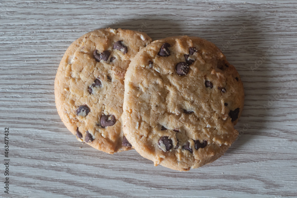 Two cookies on wooden background Two cookies on wooden background