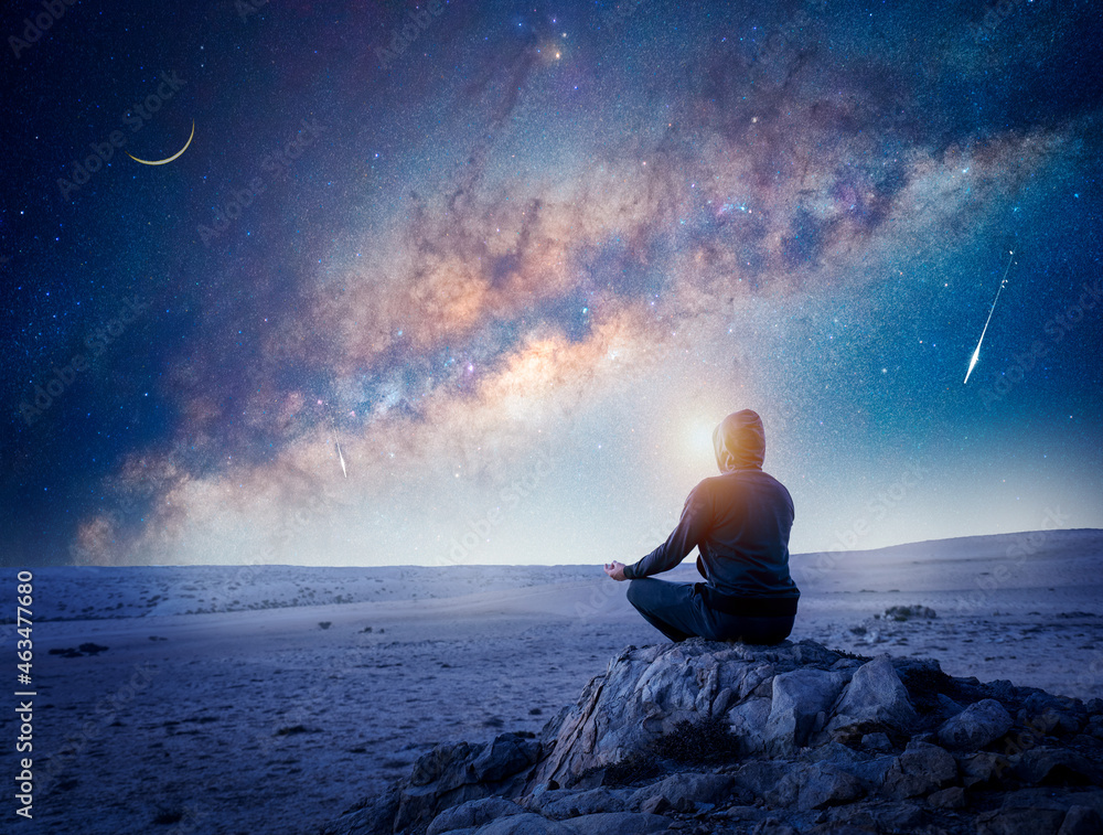 person meditating at night under the Milky Way Moon and shooting star - obrazy, fototapety, plakaty 