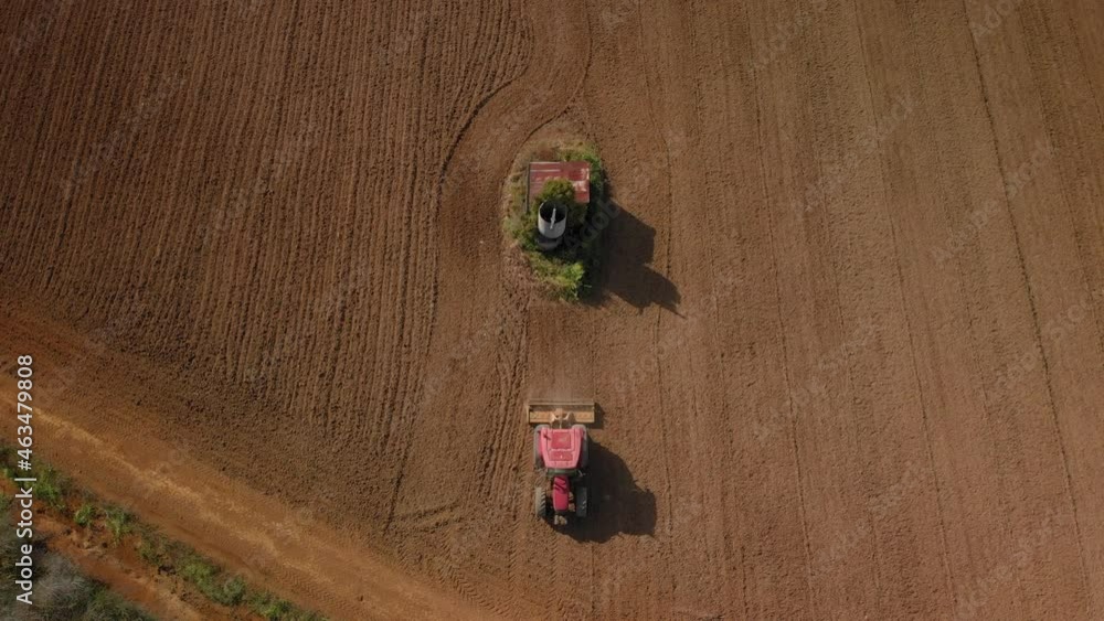 Aerial: Top Down View Of A Tractor Harrowing An Agriculture Field In Spring, Pukekohe, New Zealand Aerial: Top Down View Of A Tractor Harrowing An Agriculture Field In Spring, Pukekohe, New Zealand