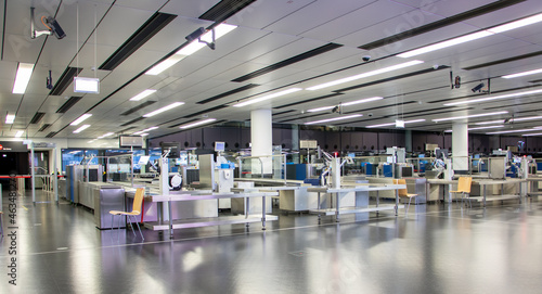 Photography The empty hall with a counters for check luggage at the airport