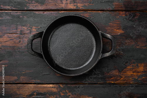 Black Empty clay pot with copy space for text or food with copy space for text or food, top view flat lay , on old dark  wooden table background