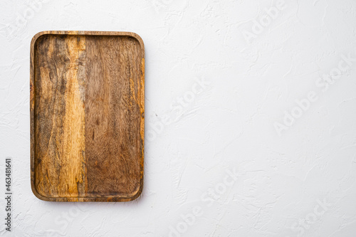 Paddle cutting or serving board, top view flat lay , with copy space for text or your product, on white stone table background