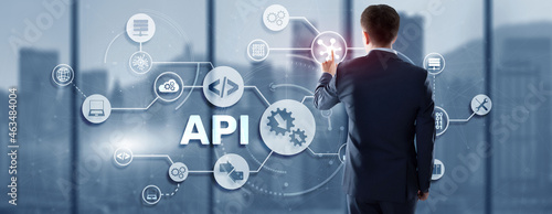 Application Programming Interface. API software development tool. Information technology concept. Businessman presses API text icon on a virtual interface