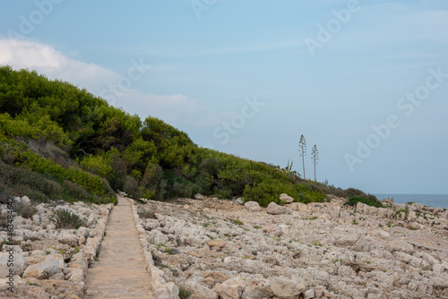 Cap d'Antibes hiking trail. Stone path at the seaside. 