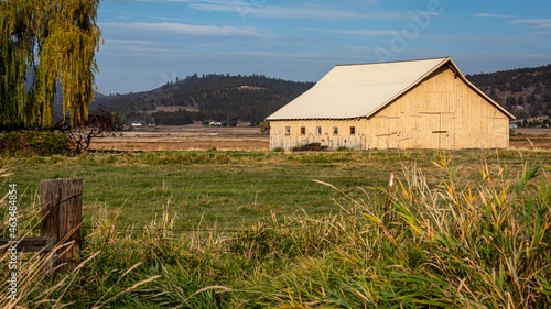 Rustic barn in pasture field