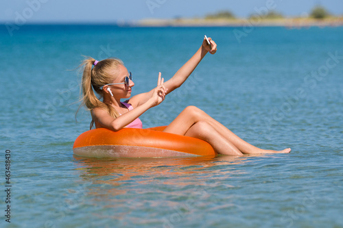 Joyful at the seaside resort taking a selfie or chatting