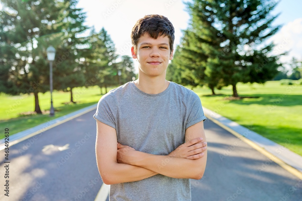 Fototapeta premium Portrait of a guy 16, 17 years old looking at the camera