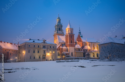 Wawel castle and cathedral covered with snow on winter night, Krakow, Poland