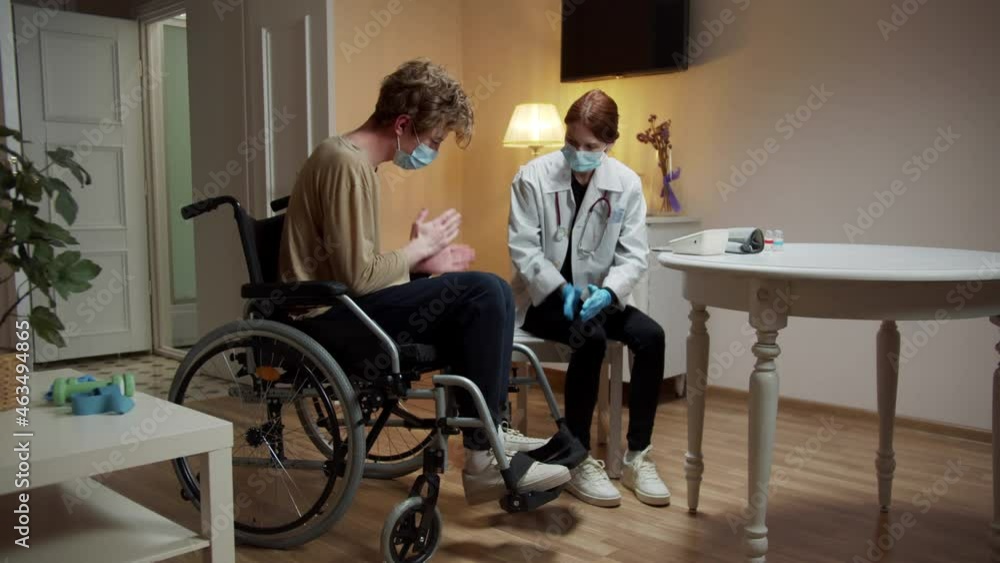 A nurse is teaching her patient how to massage A nurse is teaching her patient how to massage