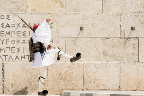 Elite soldier of the presidential guard marching front of the tomb of the Unknown Soldier in Athens, Greece photo