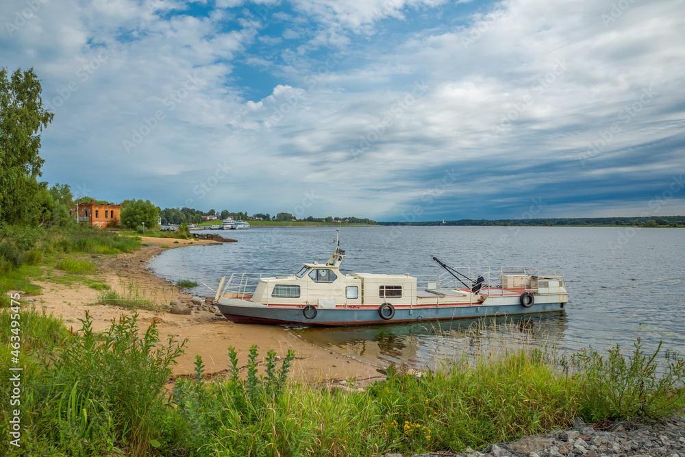 Ship, vessel on the banks of the river. Russia, Volga river Ship, vessel on the banks of the river. Russia, Volga river