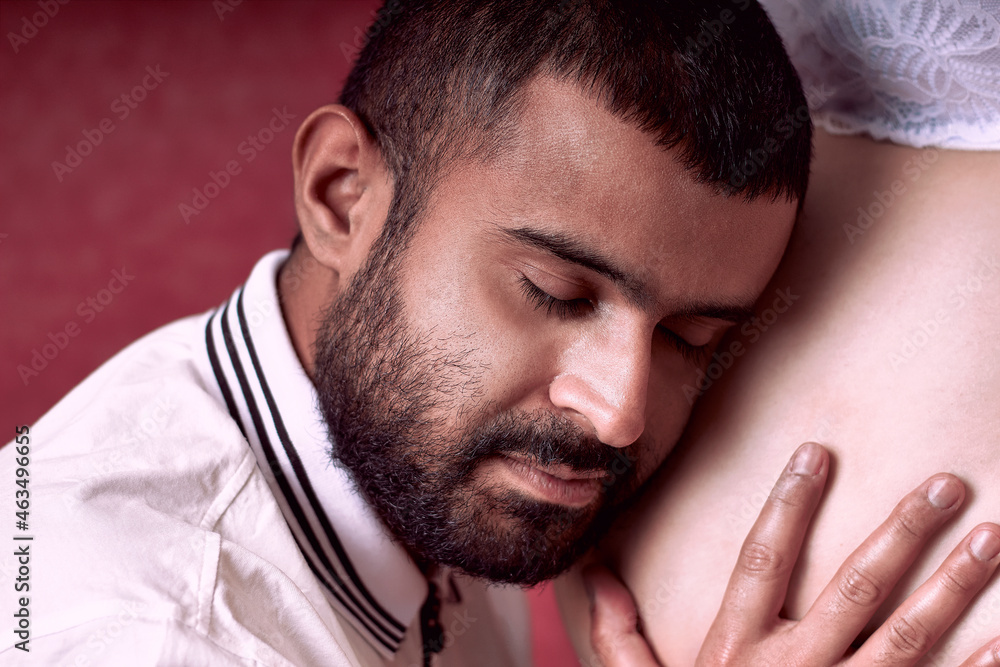 Father caresses the belly of his wife. Father caresses the belly of his wife.