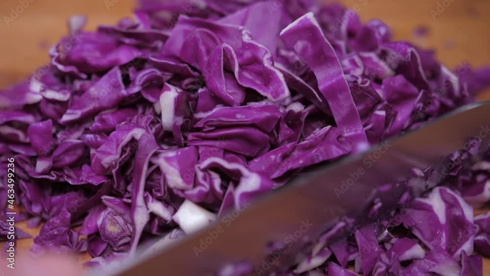 chef cutting red cabbage with knife slow motion chef cutting red cabbage with knife slow motion