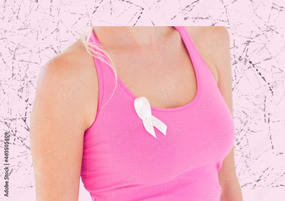 Mid section of woman wearing a pink ribbon on her sleeve against textured pink background
