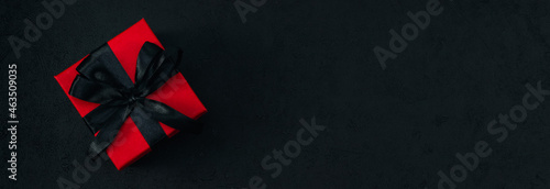 Red gift box with black satin ribbon