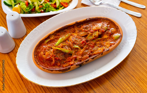 Izmir kofte, traditional turkish beef or lamb meatballs with vegetables and tomato sauce