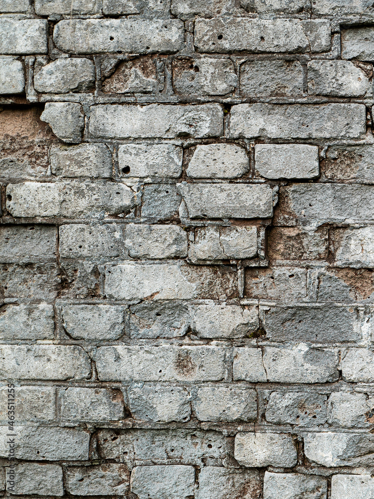 Gray old textured brick wall with cracks for background Gray old textured brick wall with cracks for background