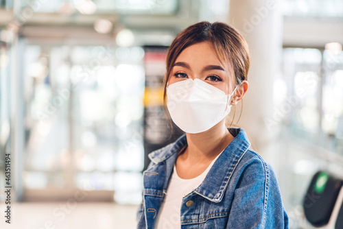 Young beautiful asian woman in quarantine for coronavirus wearing surgical mask face protection with social distancing at city.covid19 concept