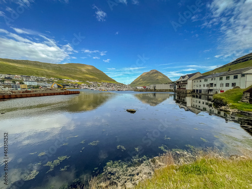 Beautiful aerial view of the City of Klaksvik in the Fareo Islands with its colorful houses and amazing canal and view to the majestic Kunoy Park