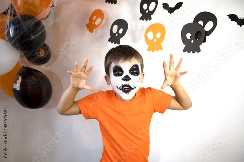 Halloween celebration concept. The boy in spooky make-up.