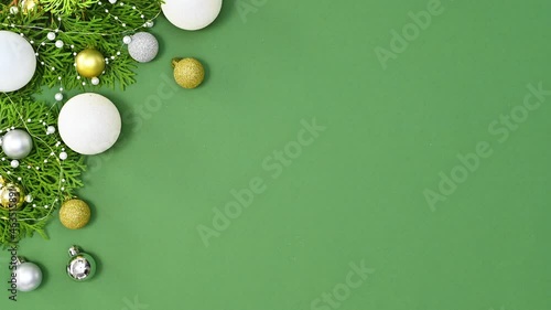 Blinking lights on New year's garland made of natural branches and trendy gold and white ornaments on green theme. Stop motion