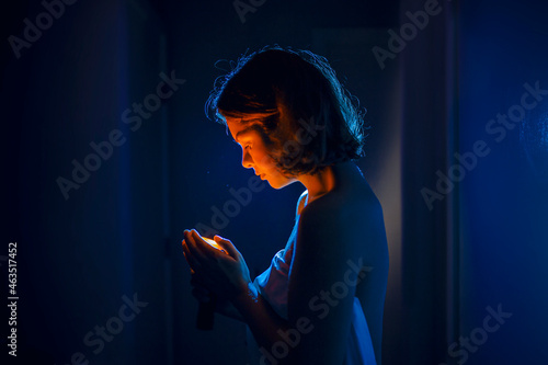 woman are looking in a phone at night