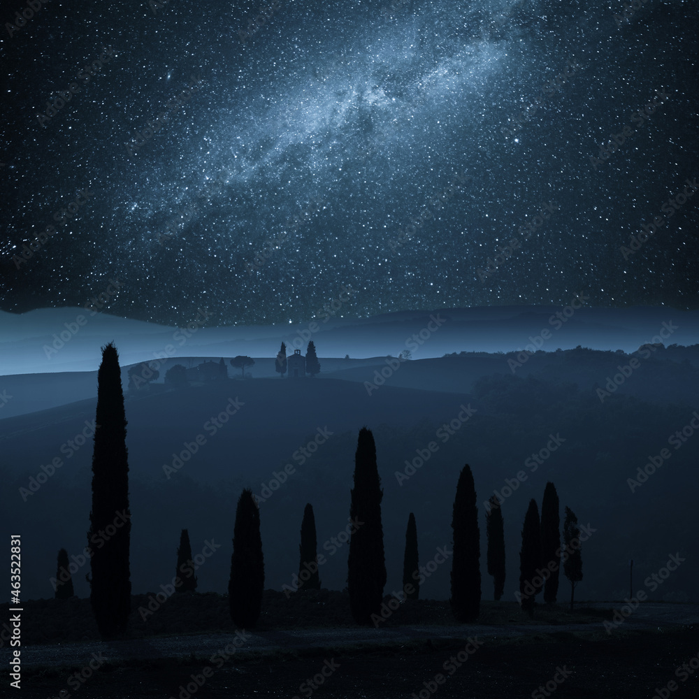 Night landscape with stars over cypress
