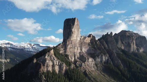 Chimney Rock in the San Juan mountains of Colorado near Ouray with Courthouse Mountain in the distance. Aerial 4K drone video in the Rocky Mountains. photo