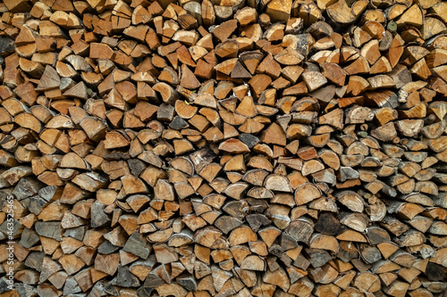Detail of wood pile. use brown structure as background. freshly chopped firewood. 