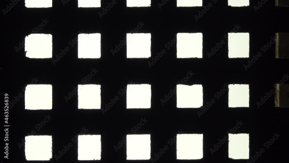 Close-up of barred window in prison cell. Close-up of barred window in prison cell.
