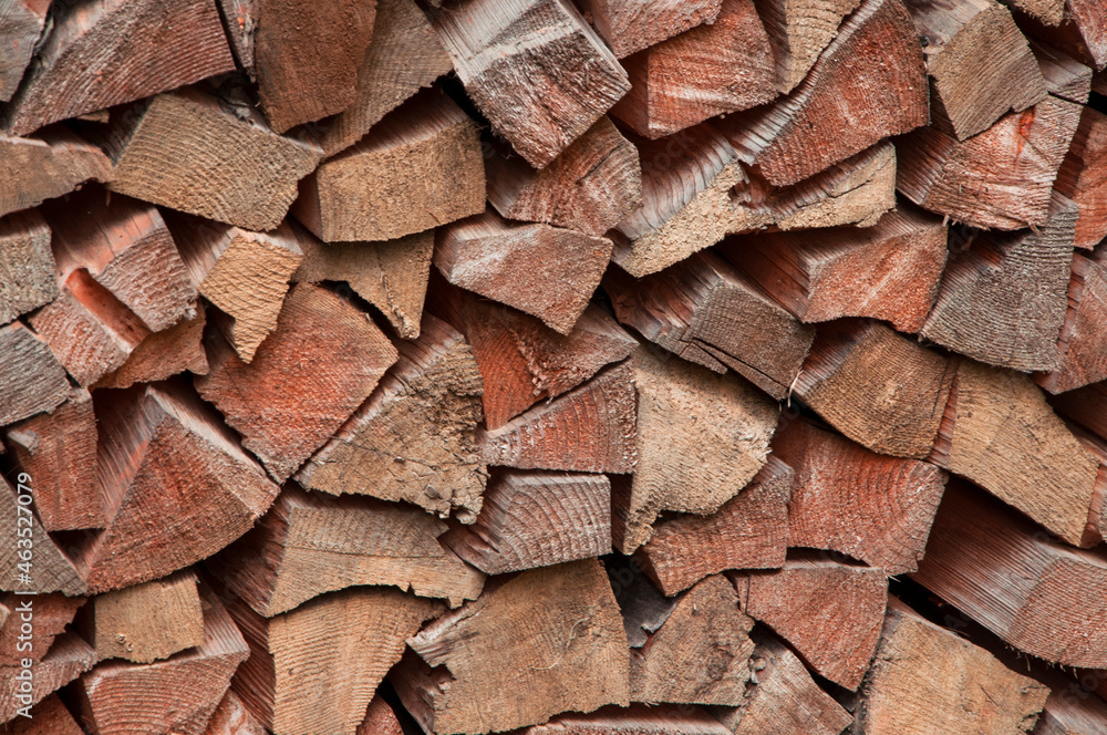 stacked chopped firewood. timber bars at a sawmill. wood background. stacked chopped firewood. timber bars at a sawmill. wood background.