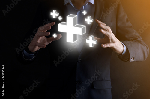 Wallpaper Mural Businessman hold 3D plus icon, man hold in hand offer positive thing such as profit, benefits, development, CSR represented by plus sign.The hand shows the plus sign Torontodigital.ca
