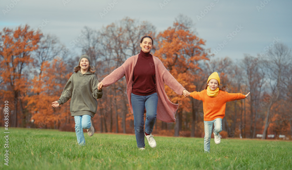 Fototapeta premium Happy family on autumn walk