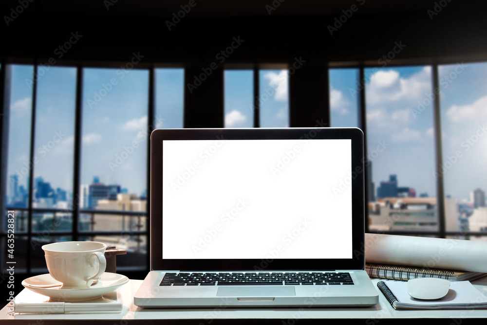 Fototapeta premium Laptop with blank screen on white desk with blurred background as concept.