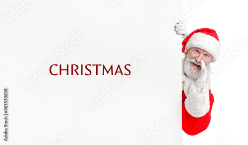 Santa Claus and poster with word CHRISTMAS on white background