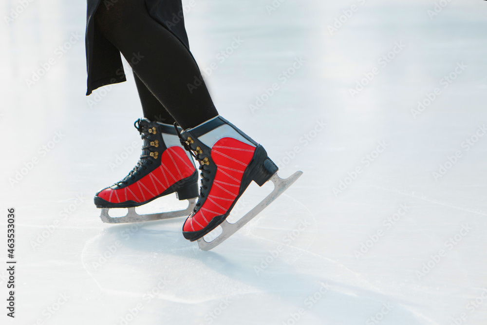 figure skater on ice. the girl is skating. ice under the open sky figure skater on ice. the girl is skating. ice under the open sky