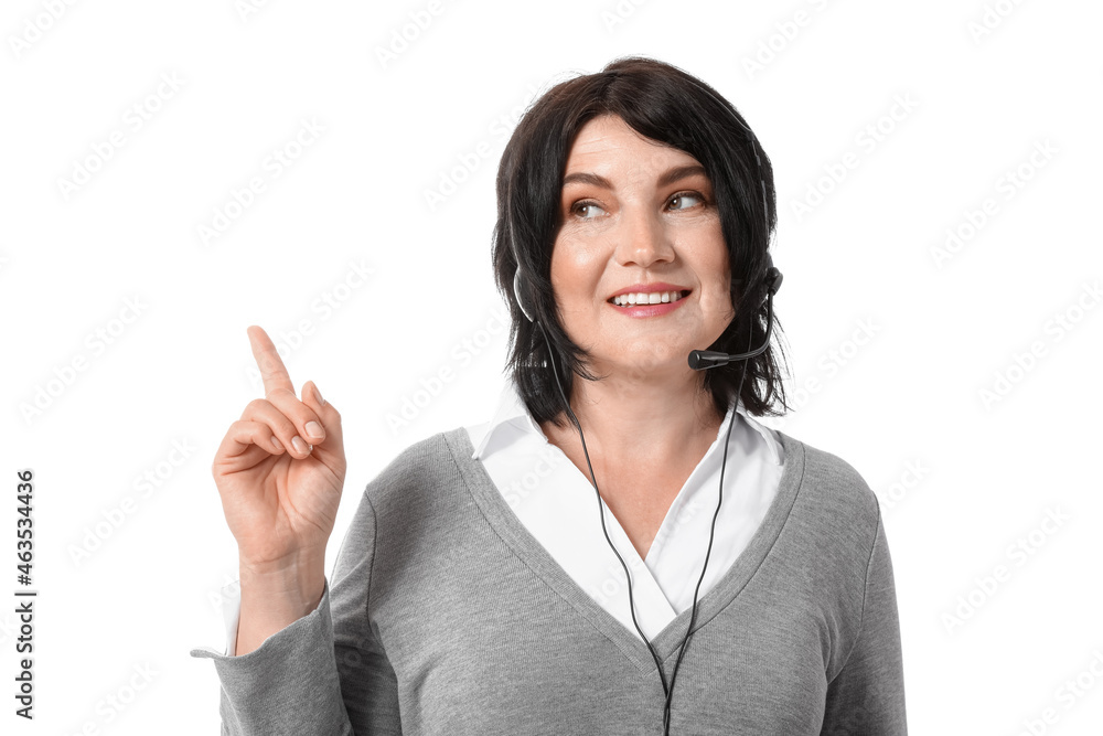 Mature female consultant of call center pointing at something on white background Mature female consultant of call center pointing at something on white background