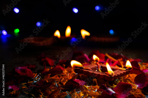 diya in flower petals during Diwali
