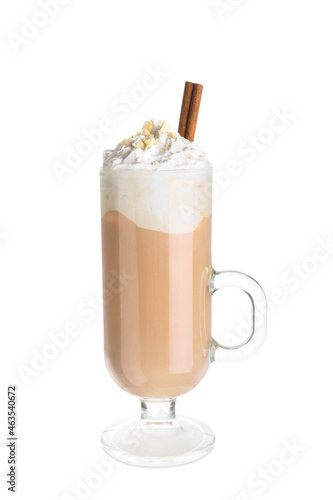 Glass cup of tasty latte with nuts on white background