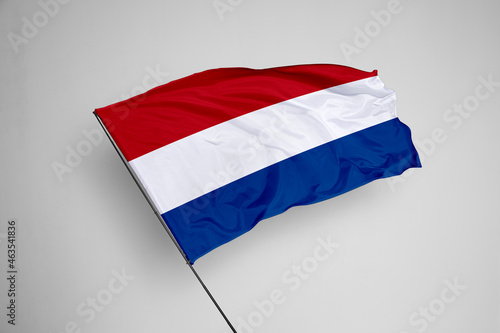 Netherlands flag isolated on white background. close up waving flag of Netherlands. flag symbols of Netherlands. Concept of Netherlands.