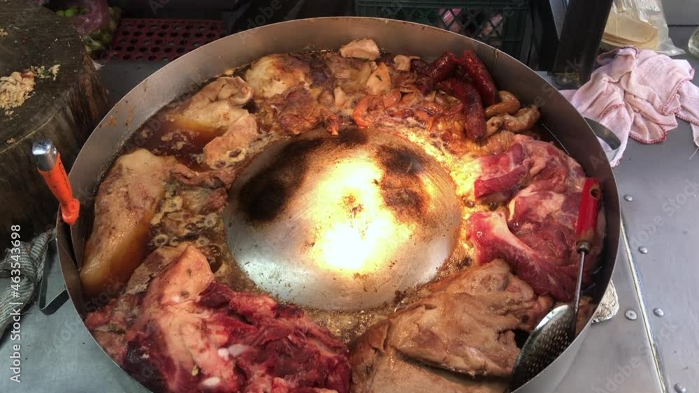 Stockvideon A mix of fresh Mexican meats cooking at a street food stand