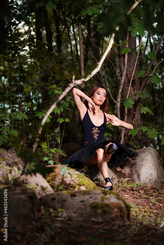 Relaxed Sensual Young Japanese Ballet Dancer in Black Tutu Posing in Summer Forest and Dreaming With Lifted Hands Behind.